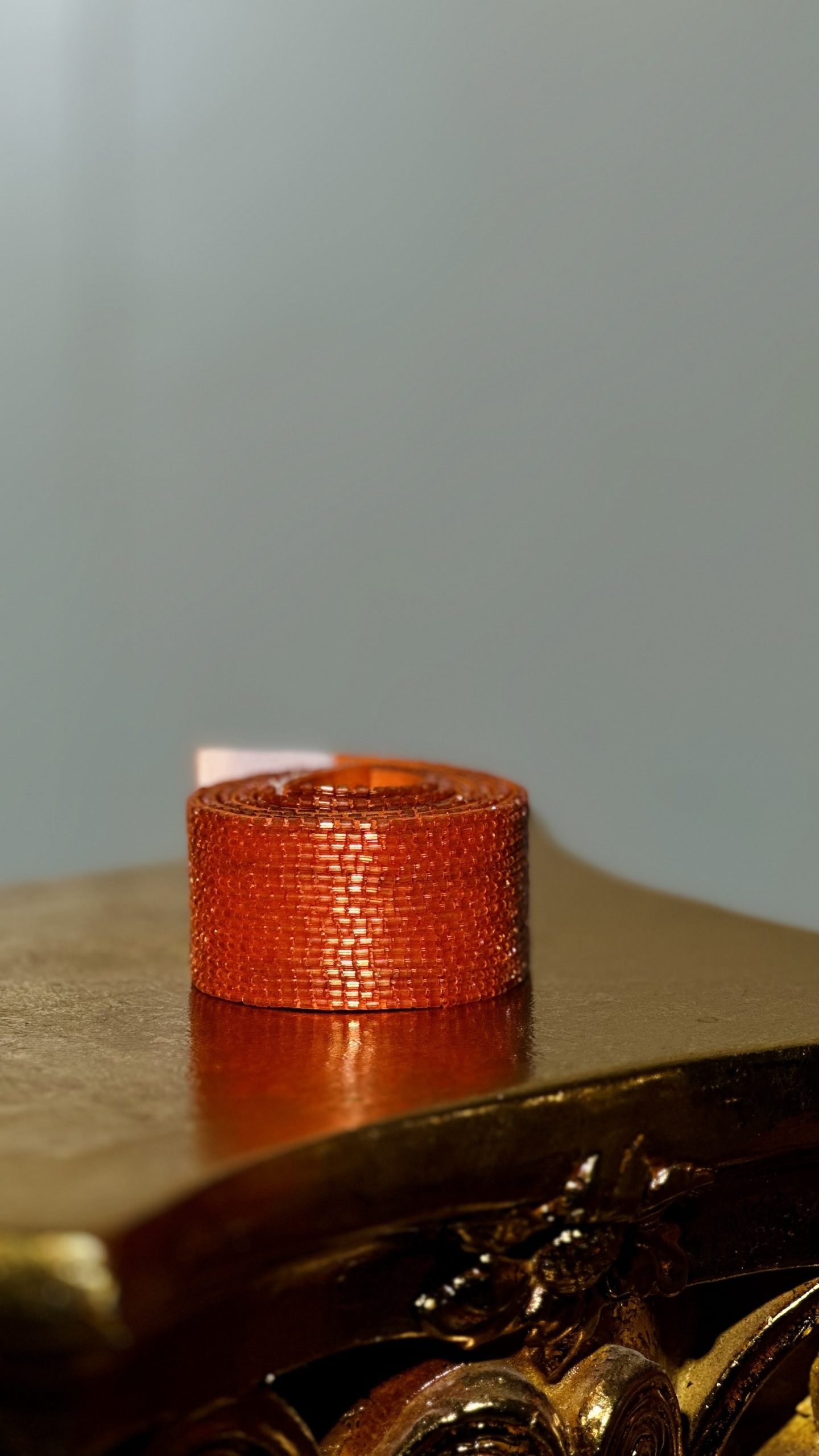 قشاط شك خرز يدوي باللون البرتقالي